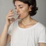 Close Up Woman Drinking Water 150x150