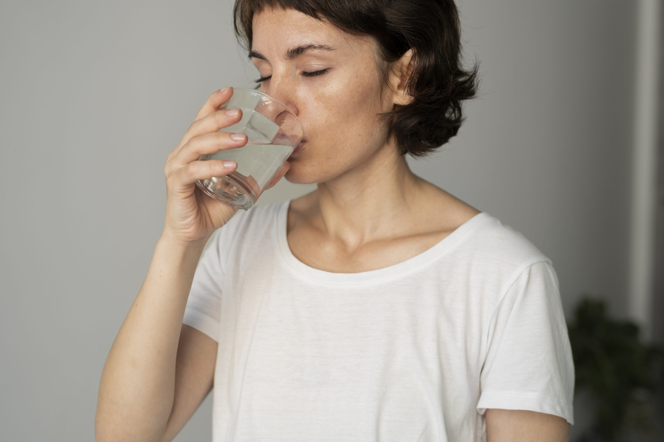Close Up Woman Drinking Water Scaled