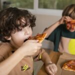 Kids Eating Pizzas Together 150x150